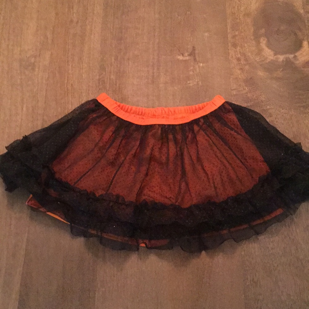 Child’s black and orange skirt with sparkle